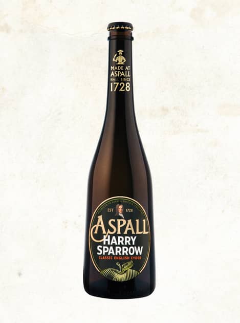 Photograph of a bottle of Aspall Harry Sparrow cyder on a cream textured backdrop.