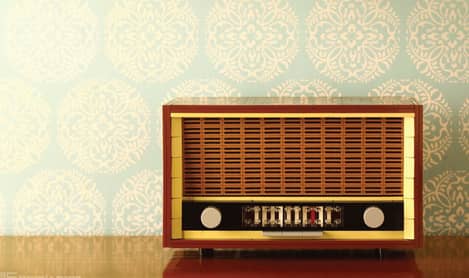 Vintage radio on wooden work top.