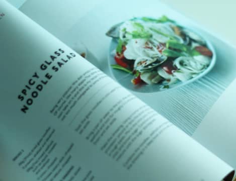 Close up image of open recipe book.