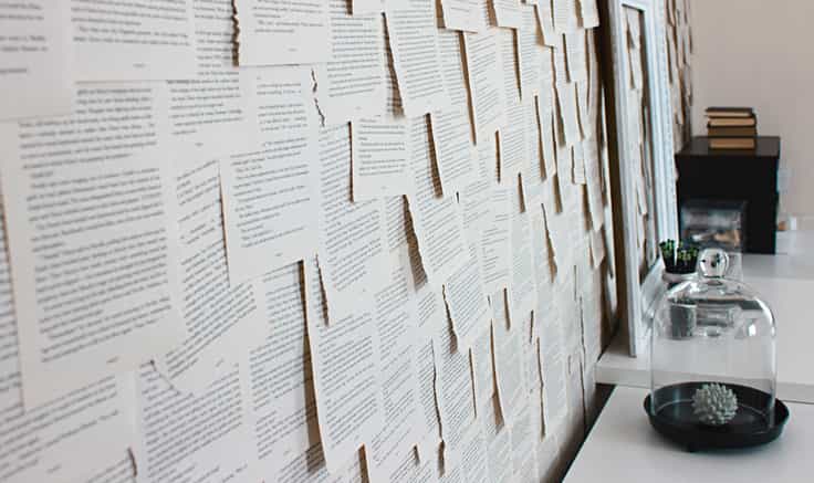 Wall covered in pages of typed text.