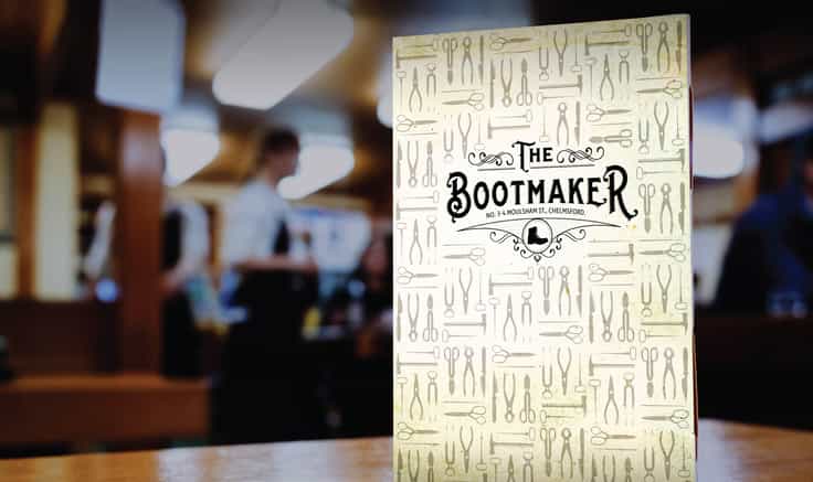 Bootmaker menu propped on a bar.
