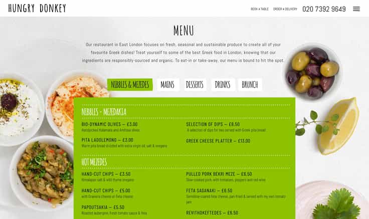 Menu page from the Hungry Donkey website: a green panle holding the menu text and images of olives and dips in the background.