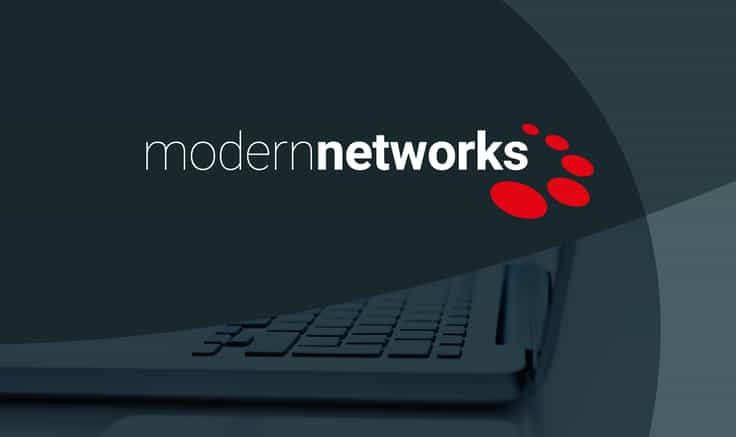 Modern Networks logo white text on a grey background with red oval graphics around the 's'.
