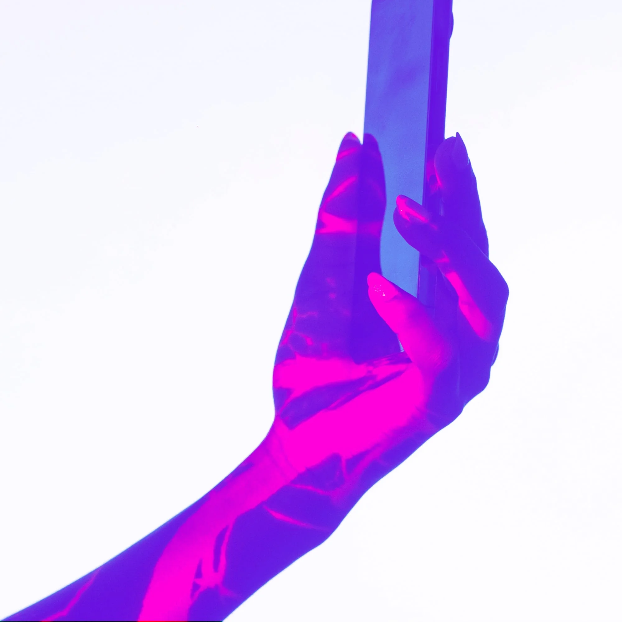 hand holding smartphone pink purple neon lighting