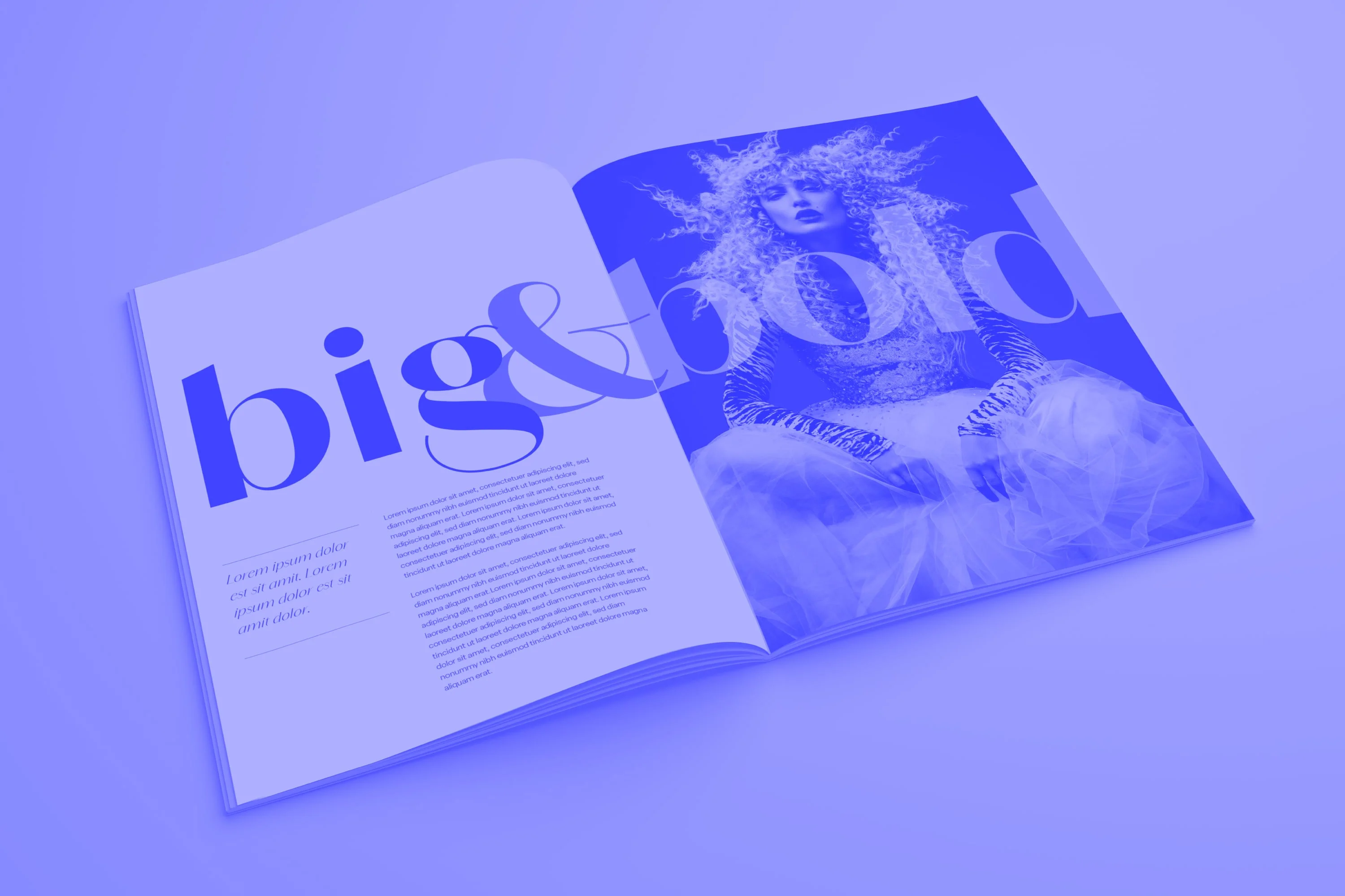 open big and bold fashion magazine showing editorial spread with model blue toned
