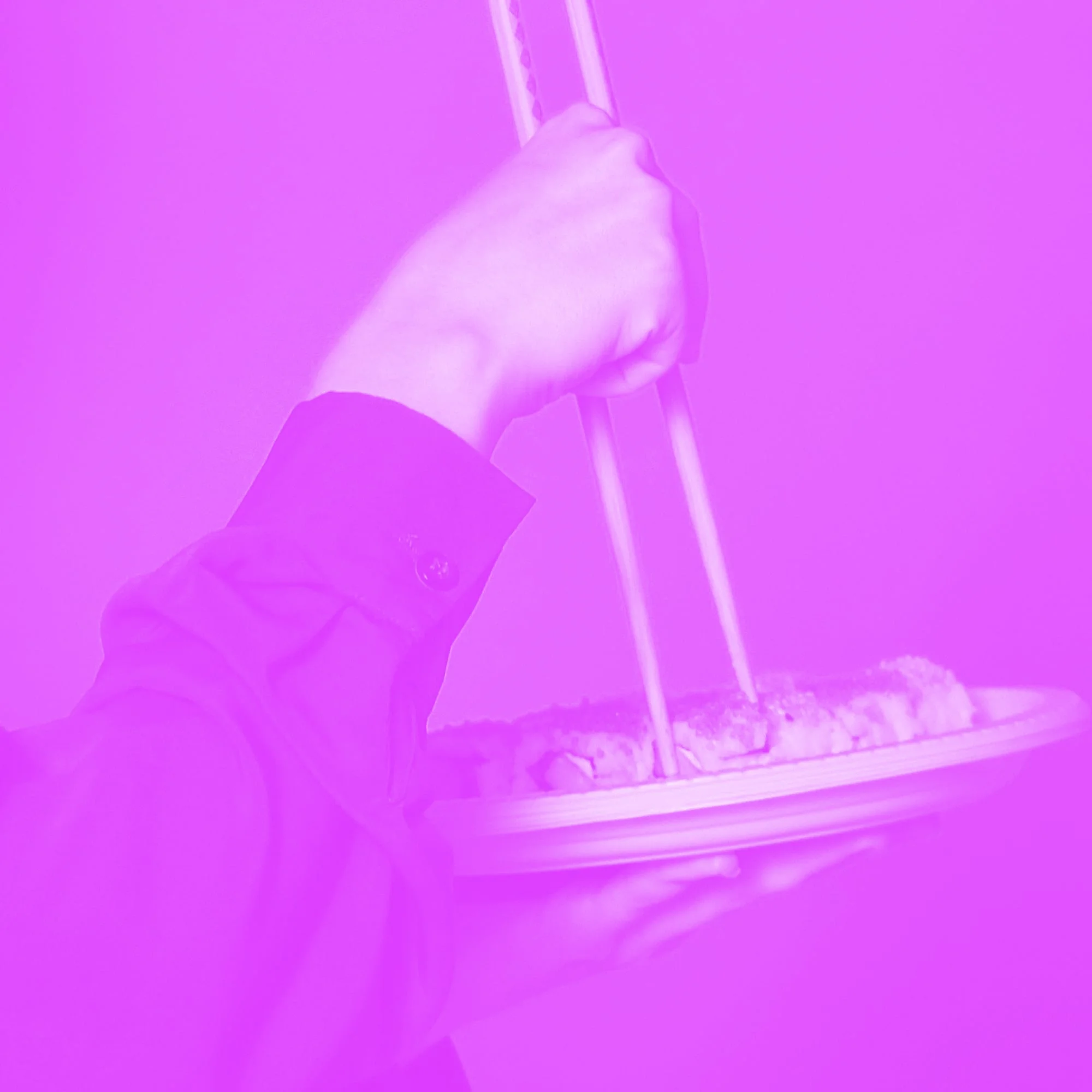 formal waiter holding plate of food with fork pink purple toned