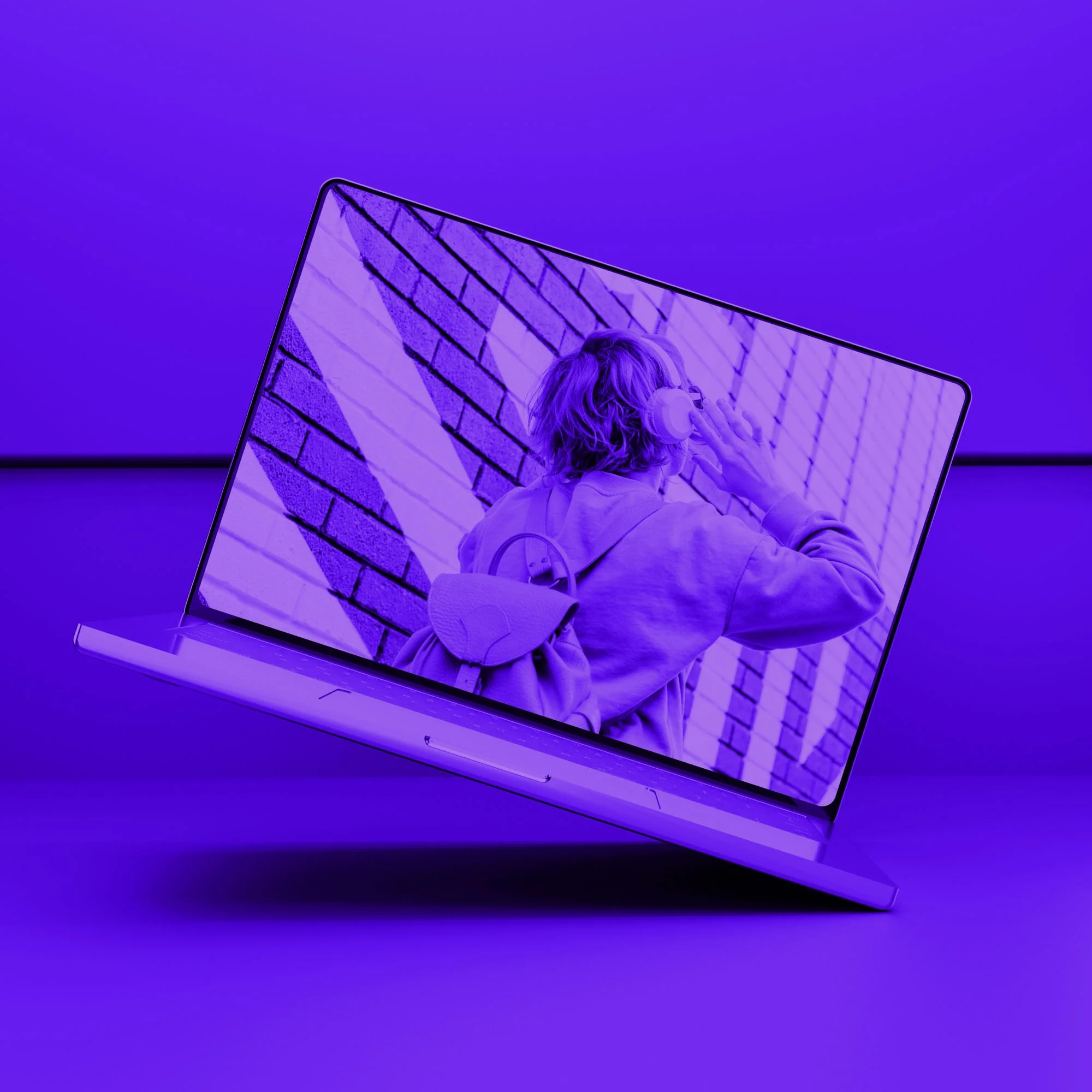 floating laptop screen showing person with headphones and backpack purple toned