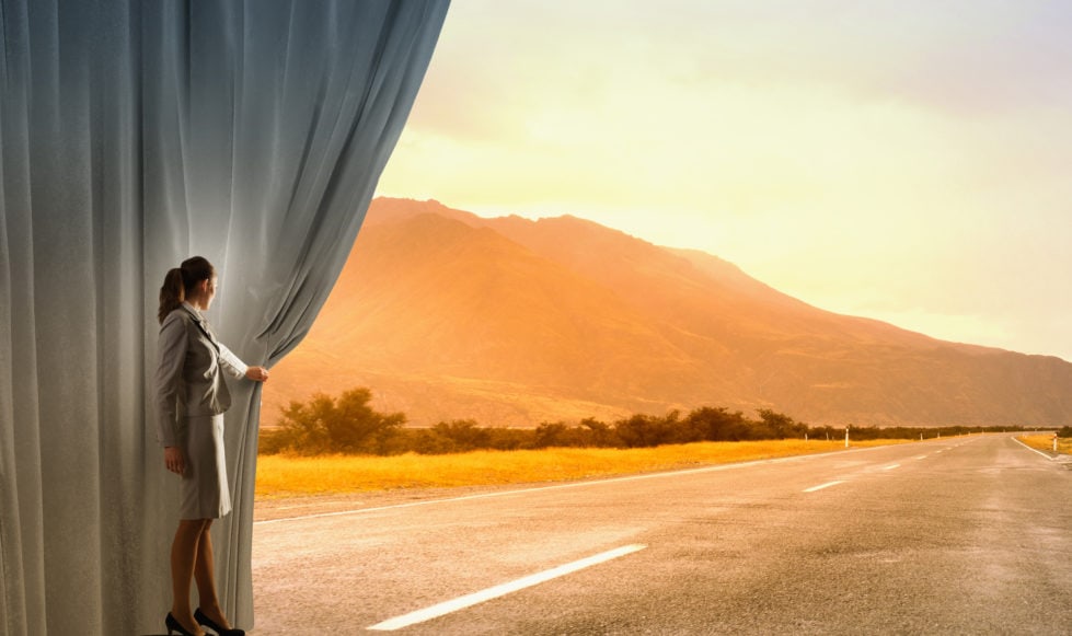 Brand images 4 Surreal image of a woman pulling back a curtain to reveal a highway.
