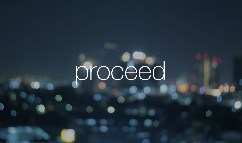 Blurred lights of dark cityscape with Proceed logo reversed out white.