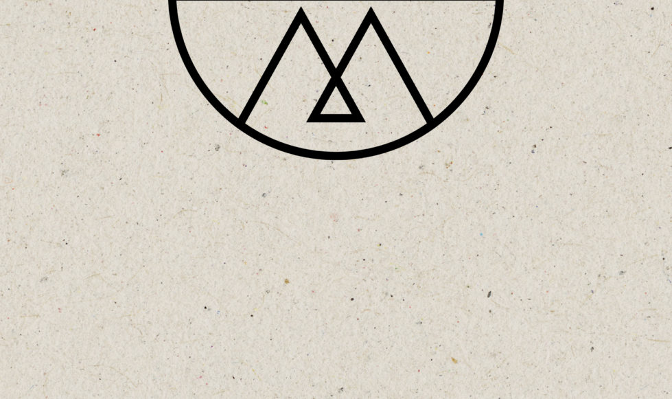 Wolf & Mermaid logo Textured brown paper background with the Wolf & Mermaid logo in black.