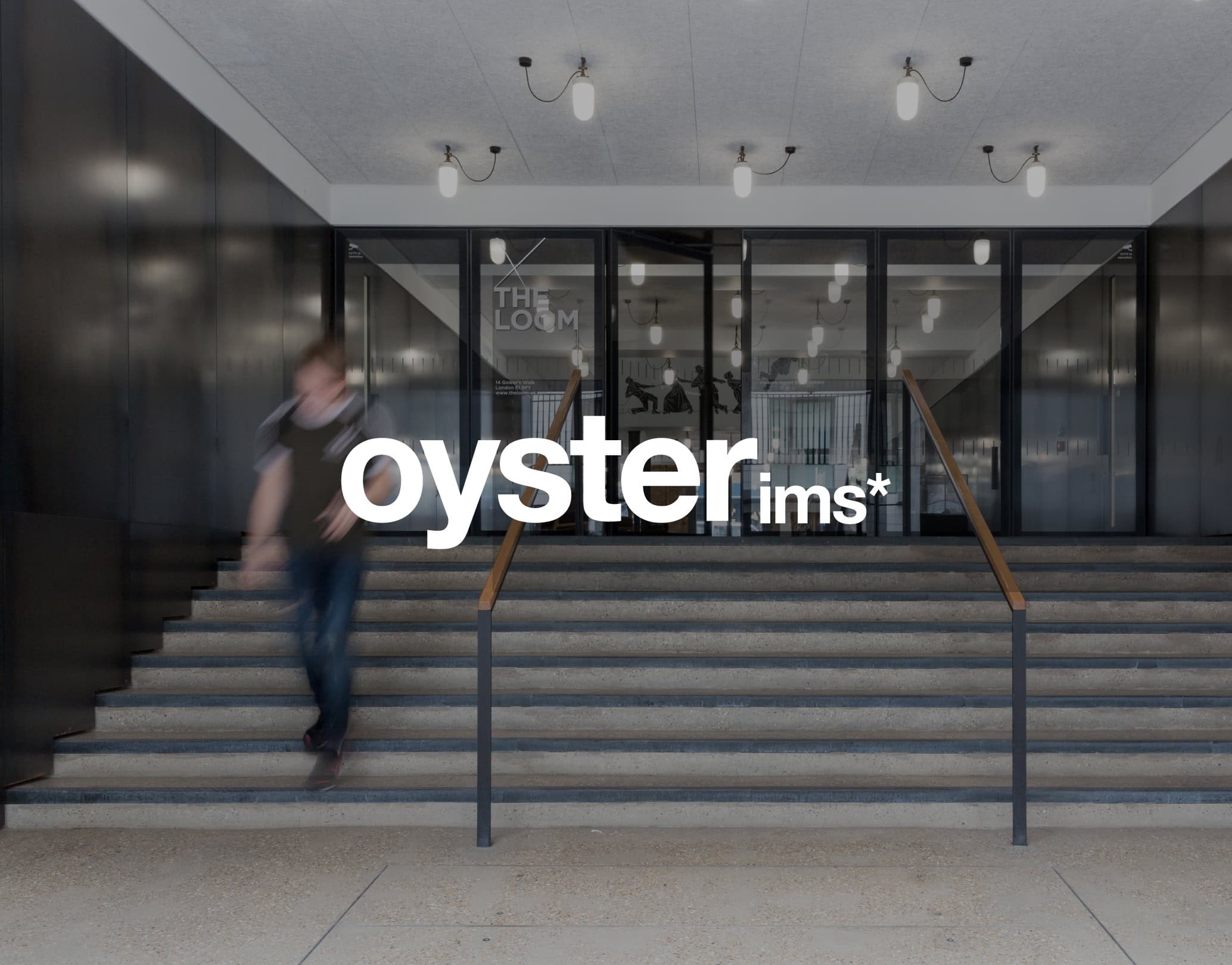 Oyster IMS logo overlaid on a modern office entrance with steps
