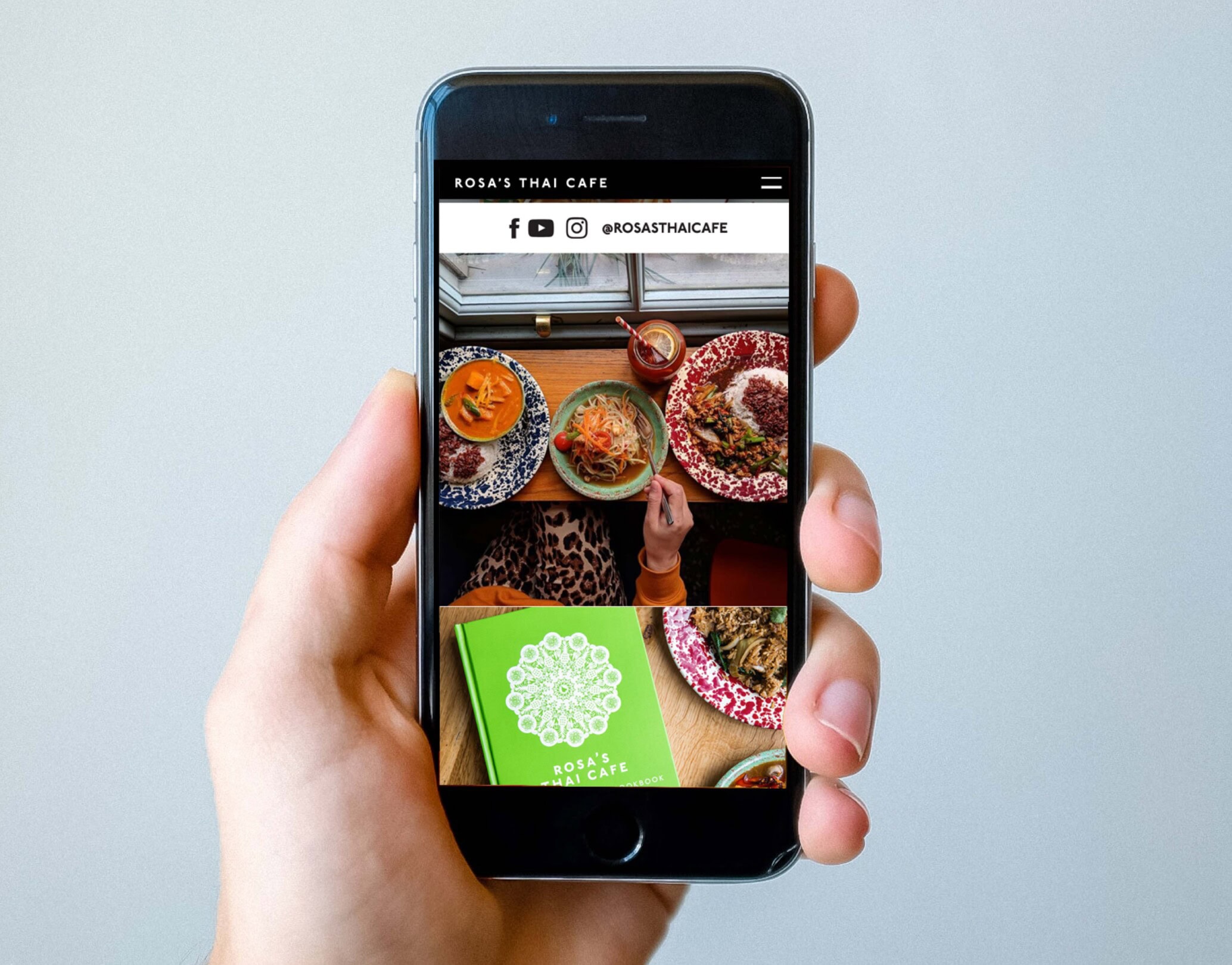 Rosa's Thai website shown on a mobile phone.