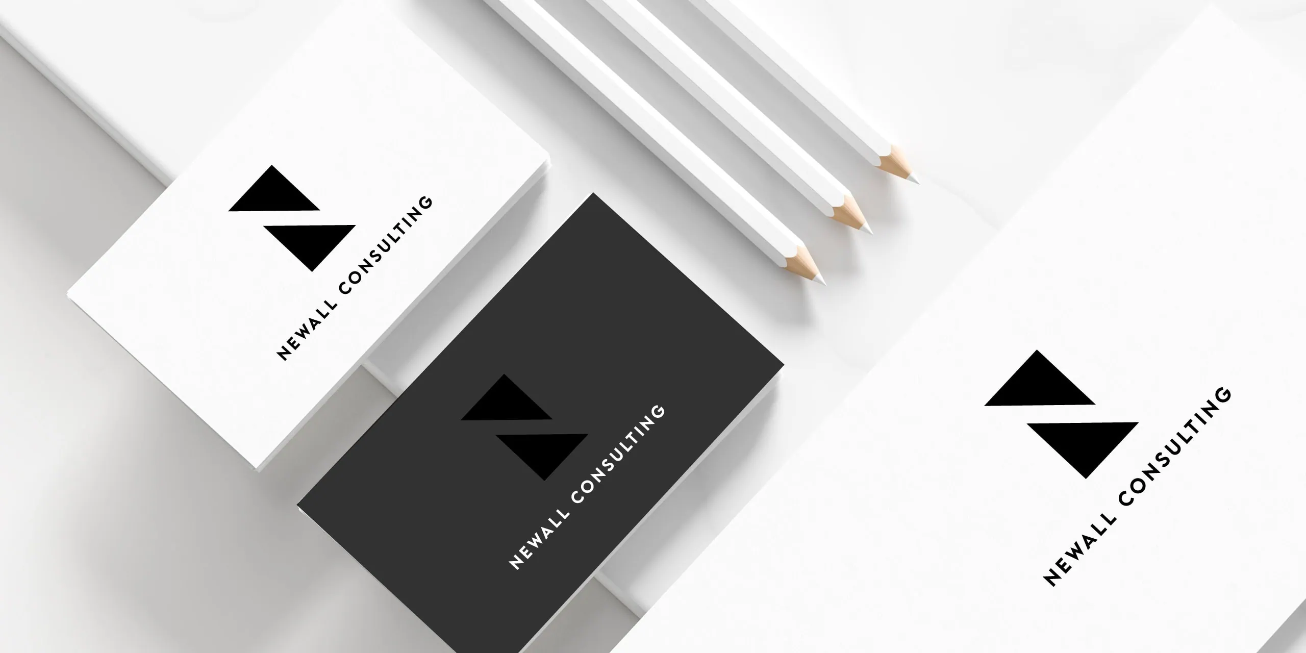 Newall Consulting business cards and stationery in monochrome