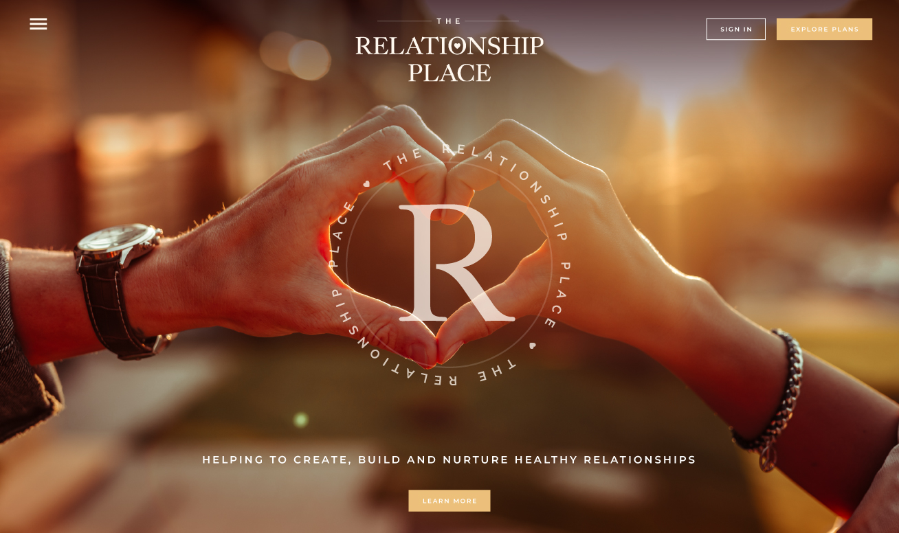 Website homepage hero with hands making a heart shape
