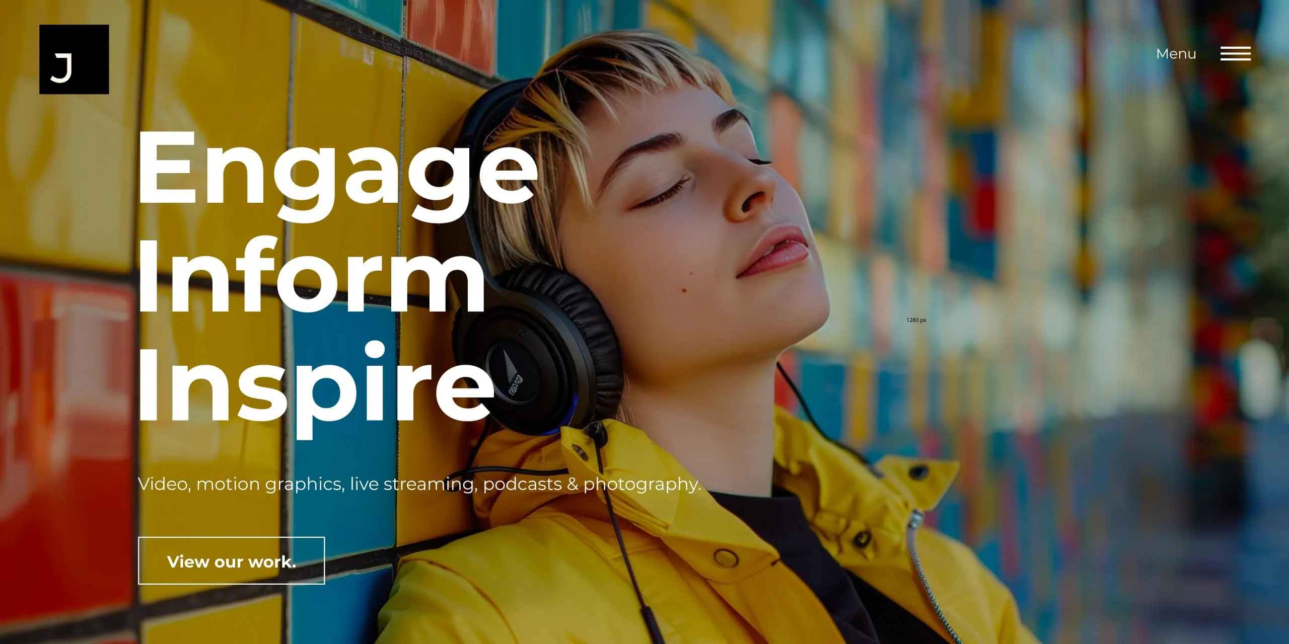 Person in yellow jacket wearing headphones against a colourful tiled wall, with “Engage Inform Inspire” headline