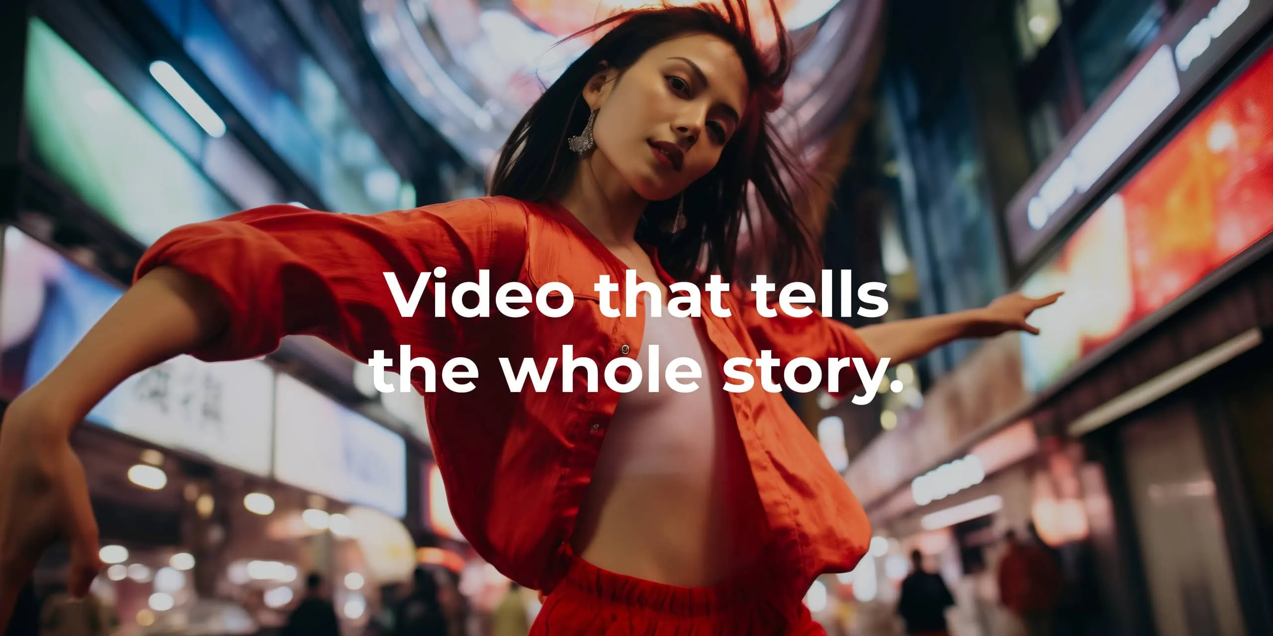 Dancer in red on a neon-lit street, with “Video that tells the whole story” headline