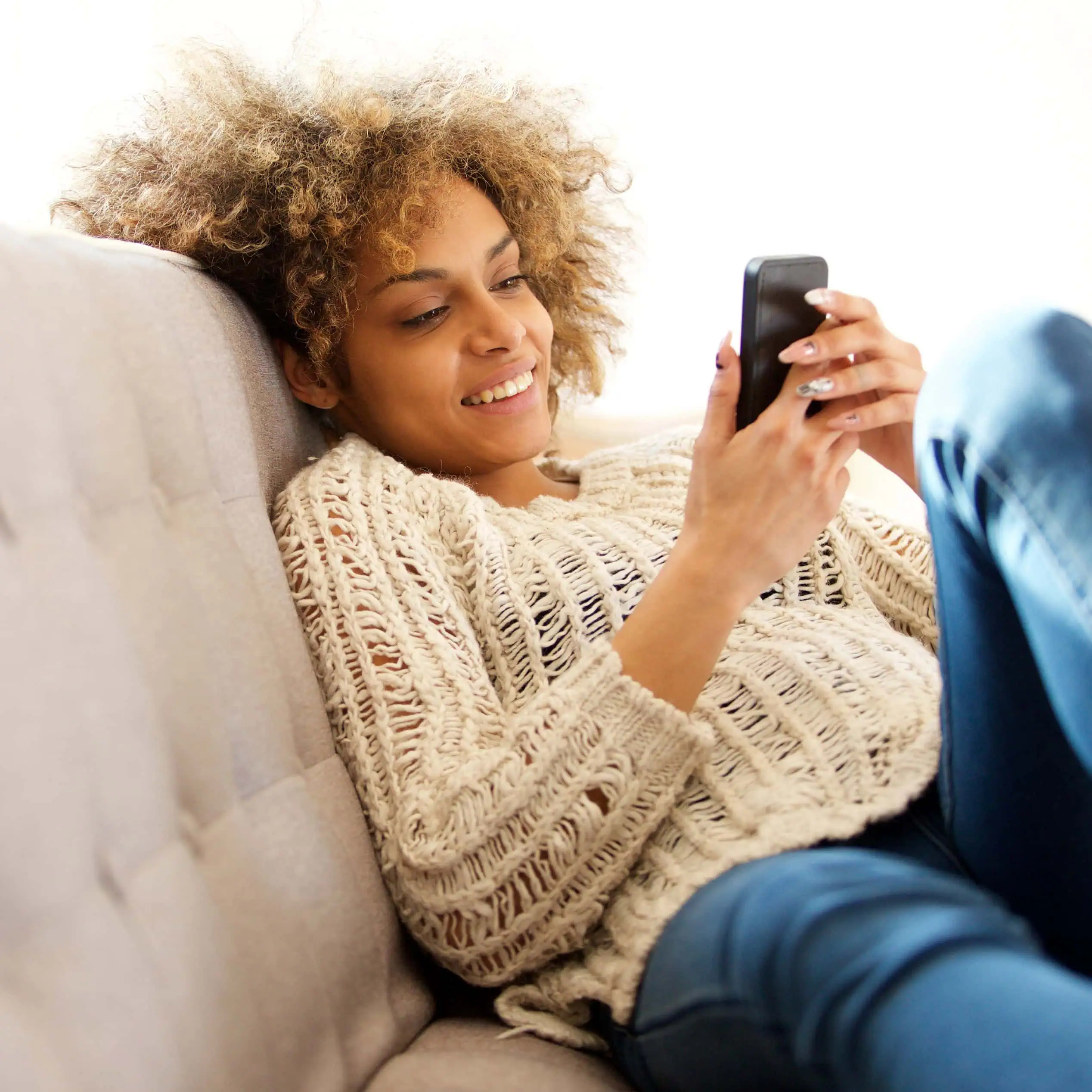 Photography style for the Mason's Property brand identity – woman browsing properties on her phone